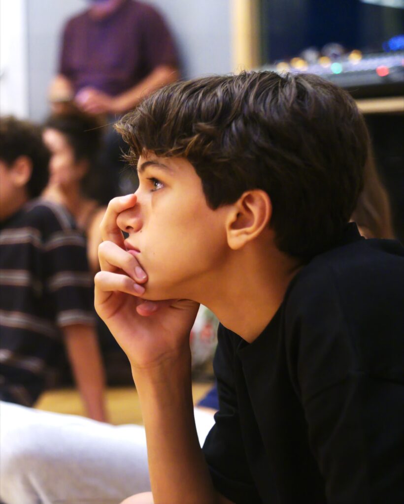 A No Drama student listening during class