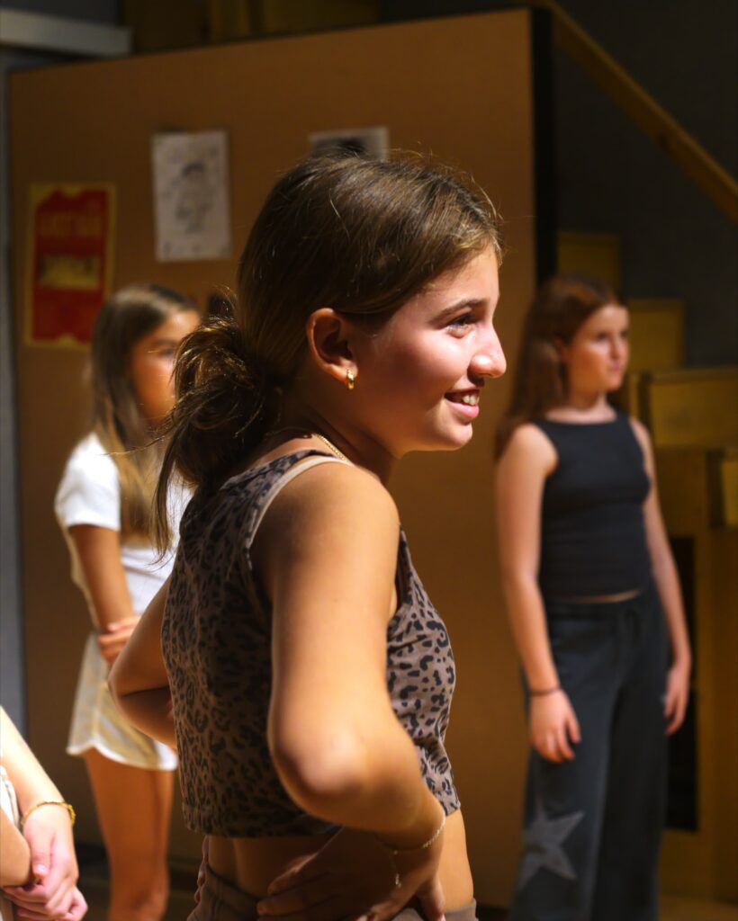 A girl smiling during a No Drama class