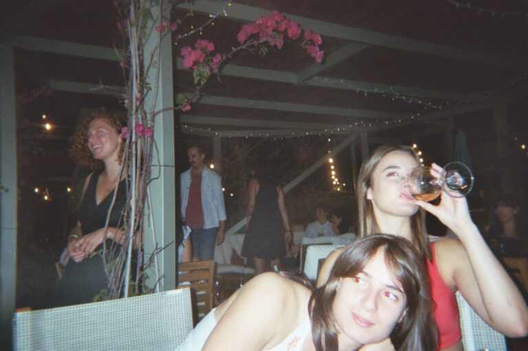 A toast at dinner among the bougainvillea, in the evening
