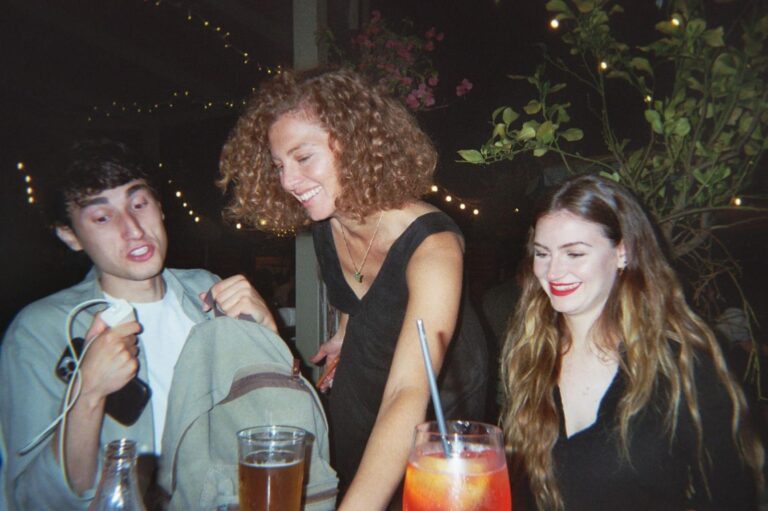 Laughter at dinner among spritz and beer, in the evening