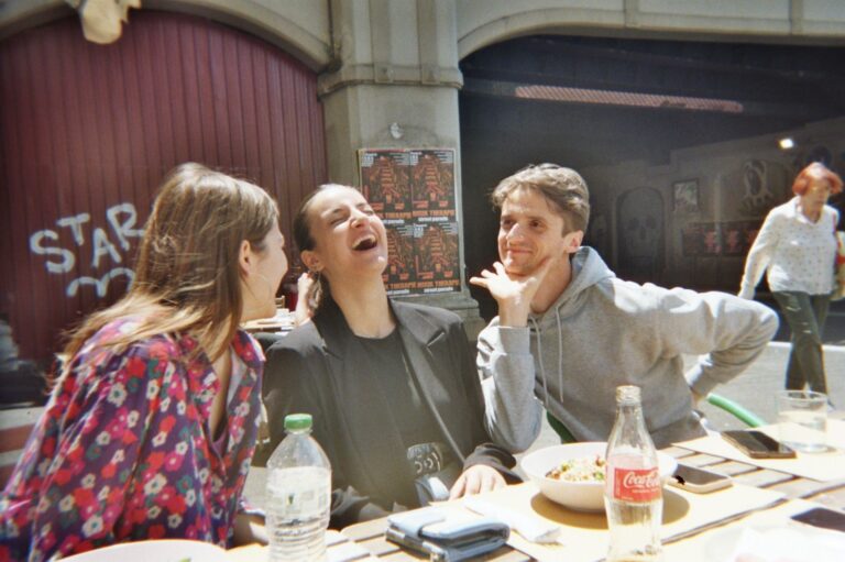 A laugh at the outdoor table, in an analogue photo