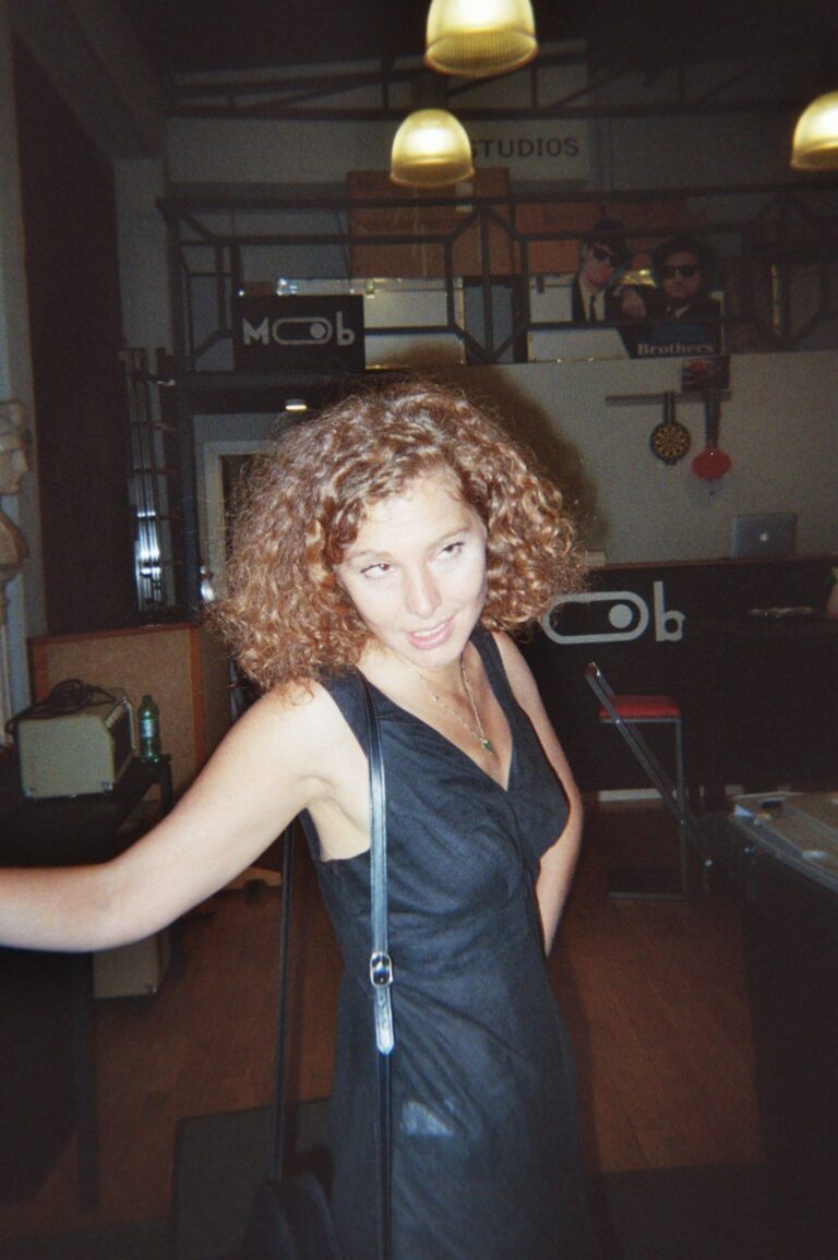 A curly-haired student in the Mob Studios entrance