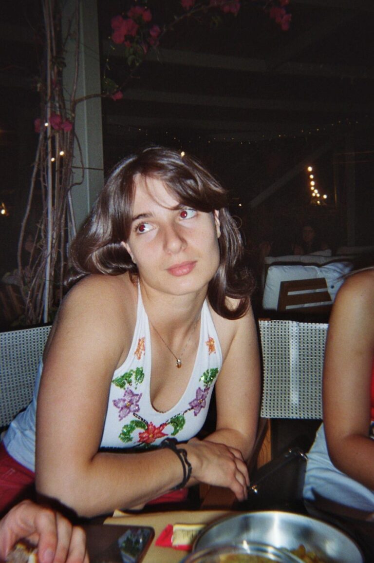 Portrait of a student in an embroidered floral top
