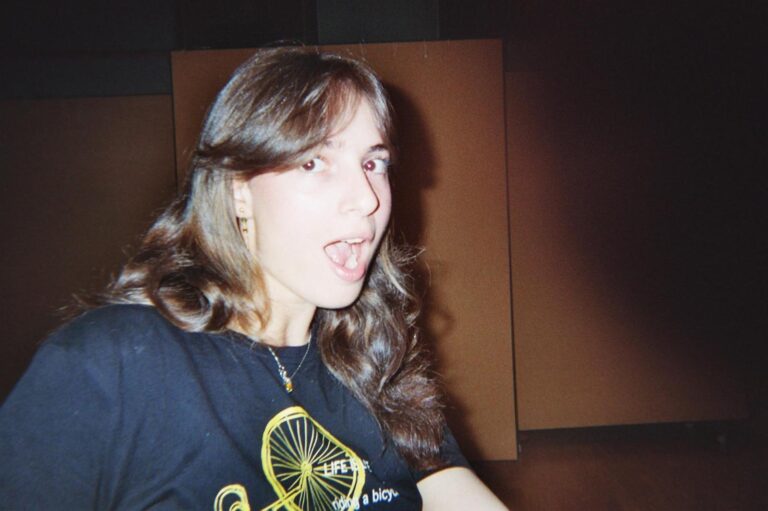 A student pulls a face, in a bicycle T-shirt