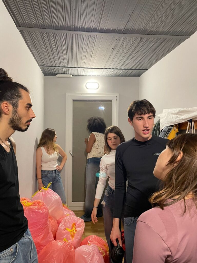 Students in the Mob corridor with the pink set bags