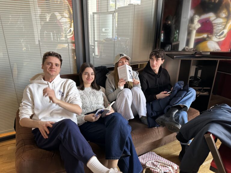 Four students on the sofa in the Mob Studios entrance