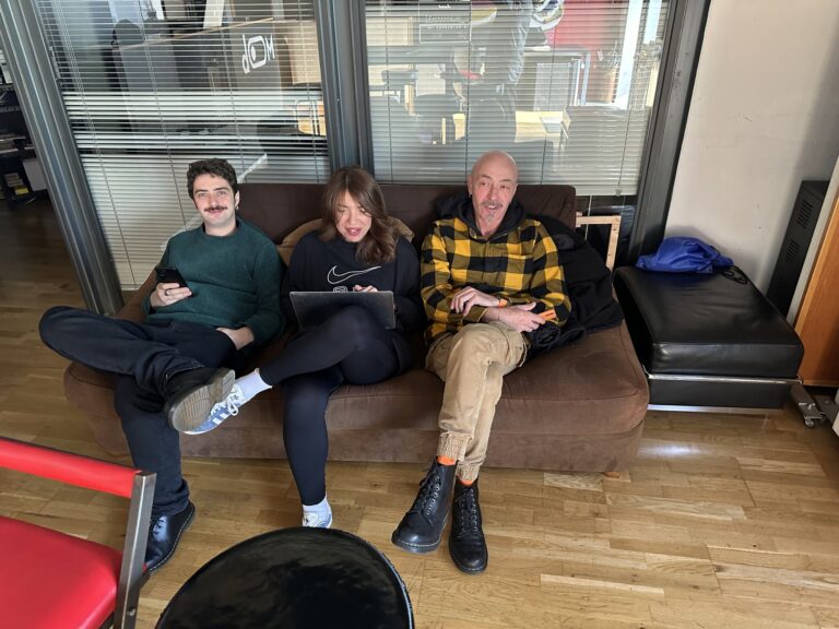 Three people on the sofa in the Mob Studios entrance