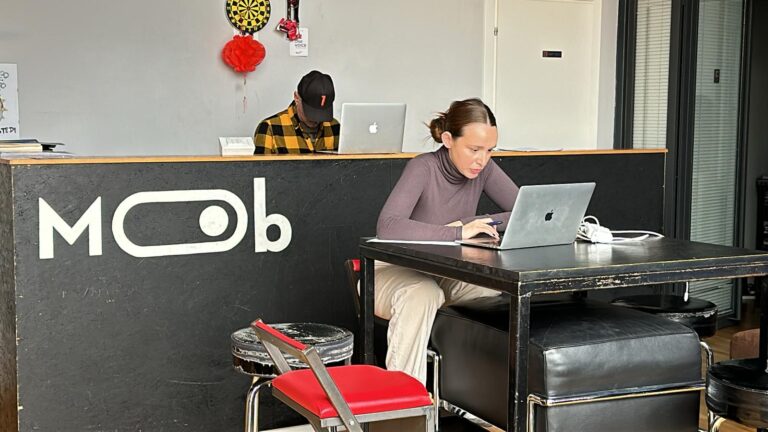 At the entrance, a student at the computer