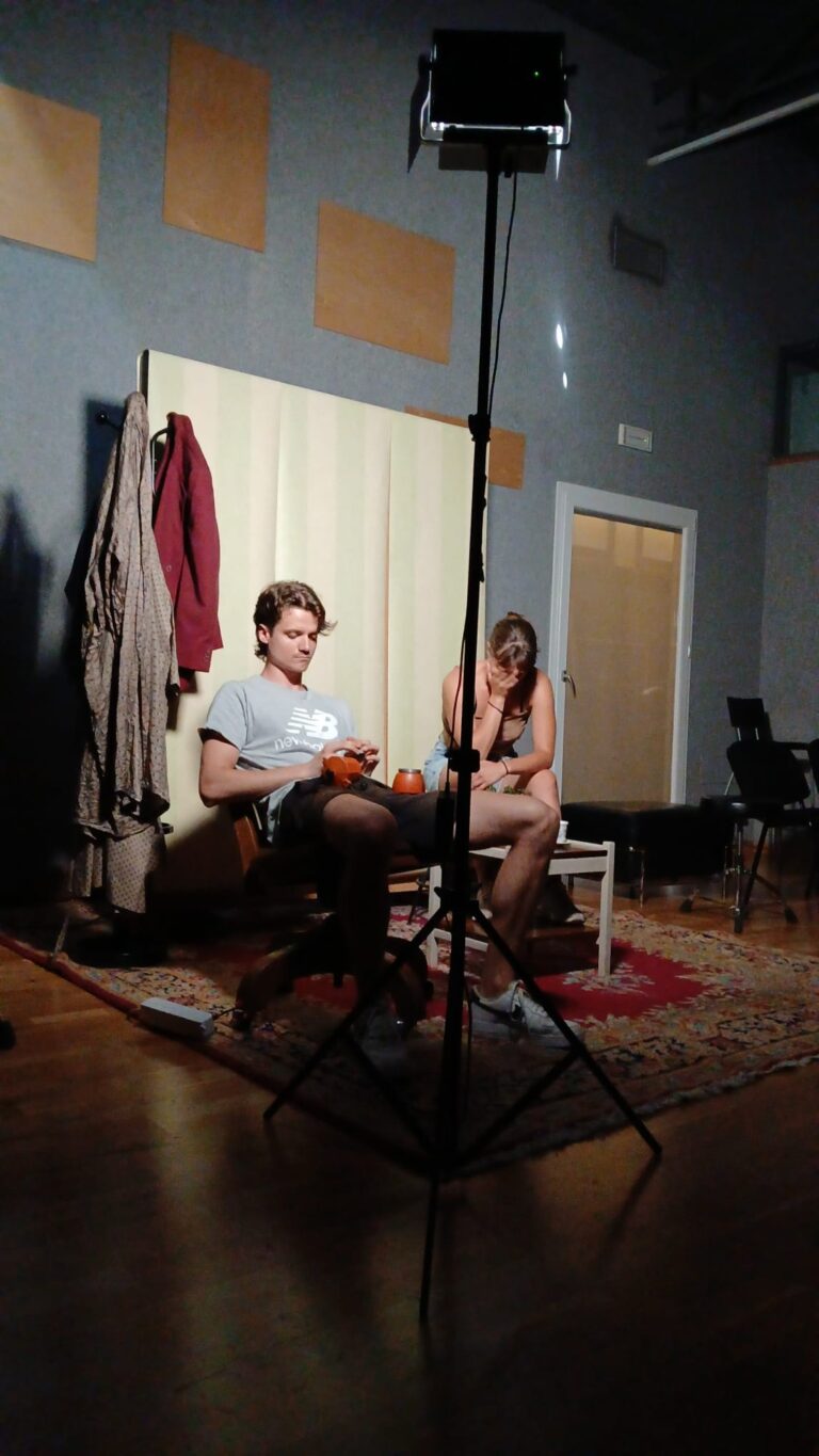 Scene rehearsal with two actors, LED light and carpet