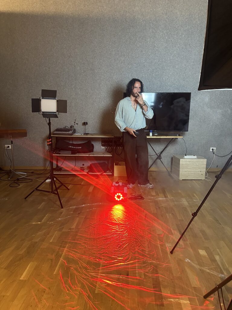 Rolling: the director standing on set with the red light
