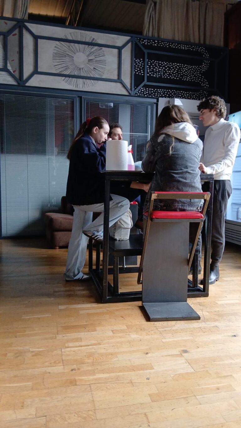 Students around the high table in the Mob Studios entrance