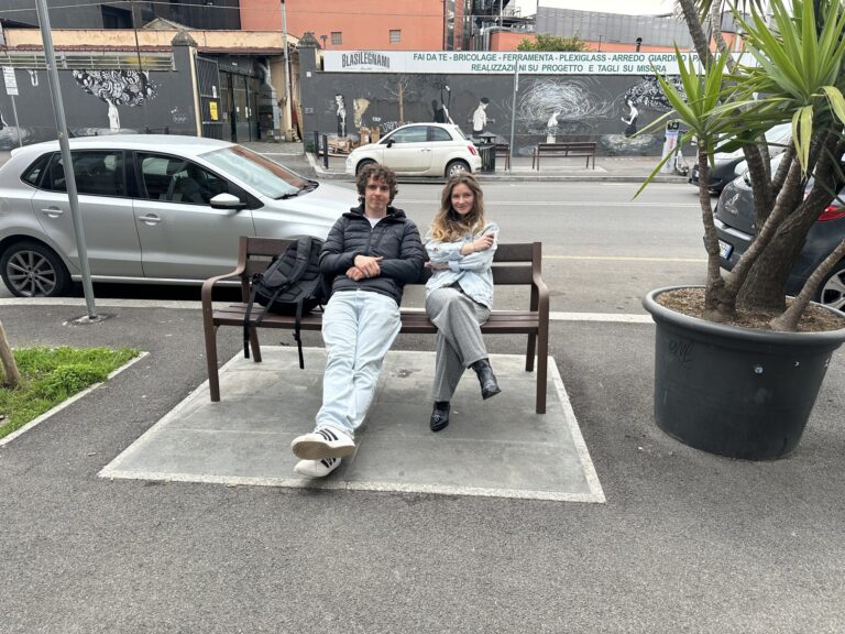 Two students on the bench outside Mob Studios