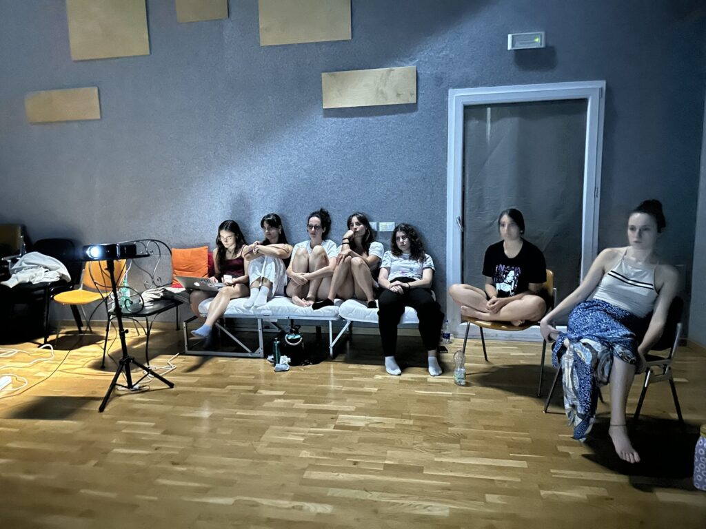 Students watching a film together in the studio